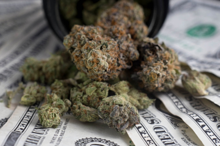 cannabis buds on US dollars